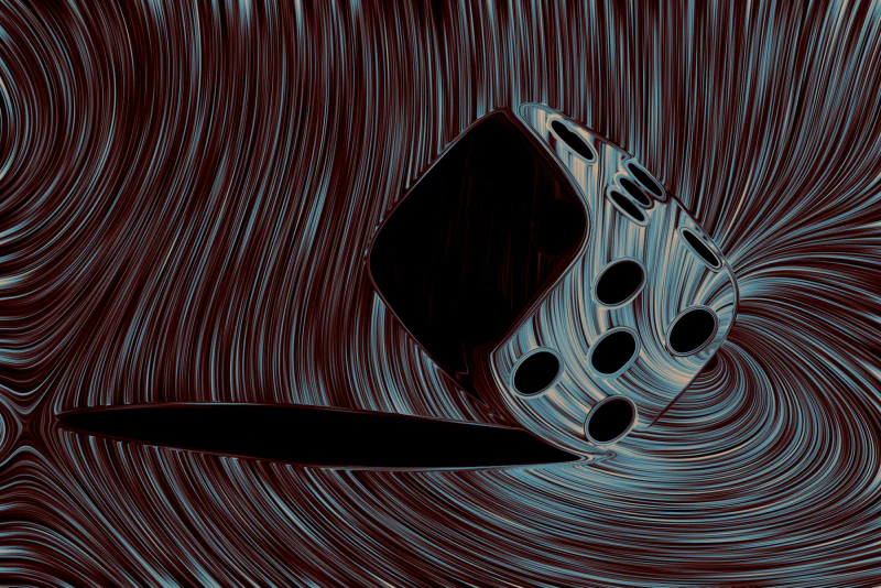 The die and its shadow smeared into dense blue, red, and black flow lines